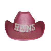 Pink cowboy hat w/ the letters 'HENS'
